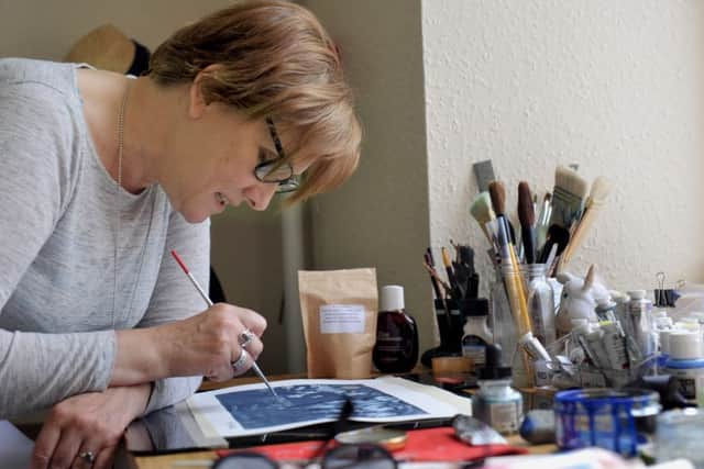 Holly Holder still uses some of her make up brushes to paint her pictures