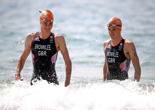 Alistair Brownlee and Jonny Brownlee in the sea before setting off on their journey to first and second in Rio.