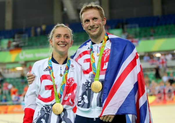 Great Britain's Jason Kenny after winning the gold medal in the men's keirin final poses with fiancee Laura Trott who won gold in the Women's Omnium. (Picture: David Davies/PA Wire)