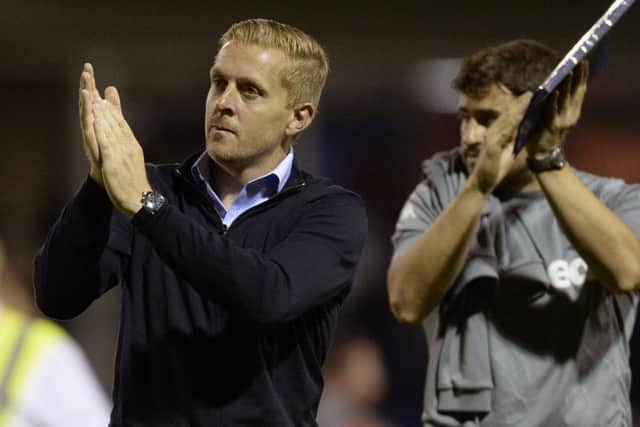 Garry Monk applauds the fans at full-time.