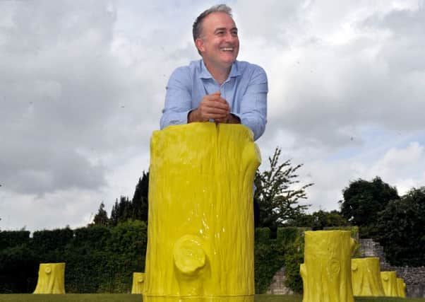 180816    Artist Charles Holland with his creation of 10  yellow ceramic tree stumps 'Foundation Myths'  the first ever installation  in the new artists garden at York Art Gallery.