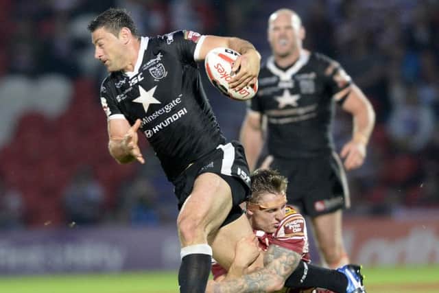 Charging to wembley: Hull FC forward Mark Minichiello on the burst against Wigan Warriors in the Challenge Cup semi-final at the Keepmoat Stadium, Doncaster. Picture: Bruce Rollinson