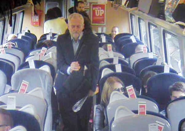 Handout footage from Virign Trains of Jeremy Corbyn looking for a seat on the London to York and Newcastle service.
