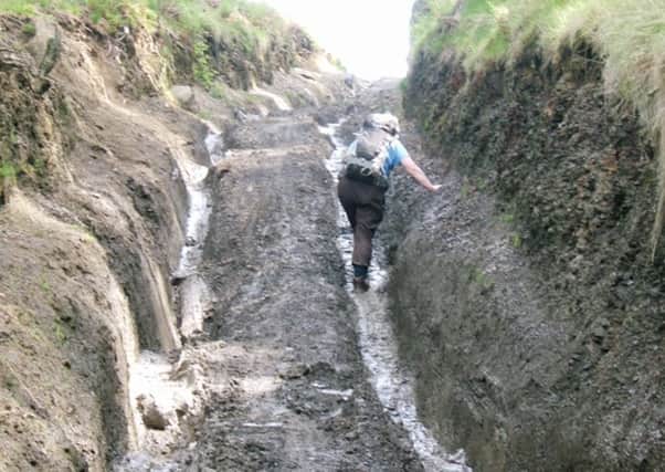 A walker struggles amid mud on the green lane at Coleson Bank
Picture: North York Moors Green Lanes Alliance