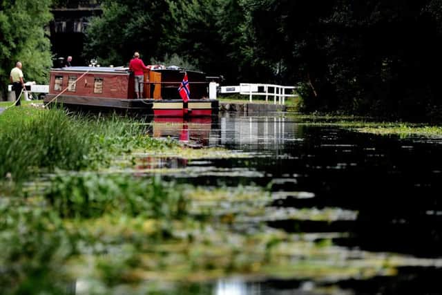 A narrow boat stops just before Lock 3 at St Ann Ings Lock on the Leeds & Liverpool Canal.