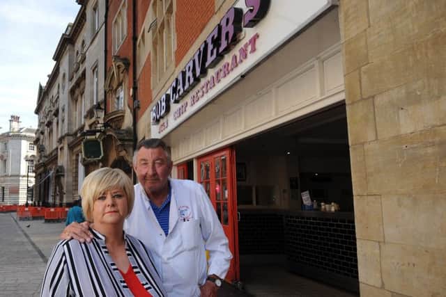 Carol and Bob Carver pictured outside their fish and chip restaurant on Trinity House Lane.