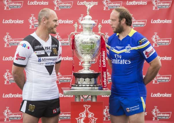 SEE YOU THERE: Hull FC's Gareth Ellis (left) with Warrington Wolves' Chris Hill . Picture: Danny Lawson/PA.