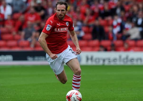 Aidy White launching a raid for Barnsley in the Championship game against Derby