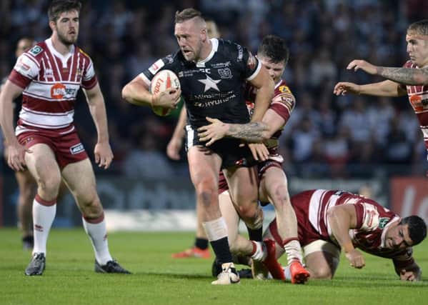 Hull FC's Liam Watts bulldozes his way through the Wigan defence in the Challenge Cup semi-final.