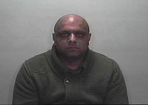 Khalid Khan is wanted for robbery and assault.