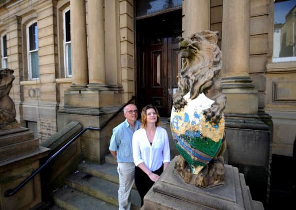 Chris Marsden and Madeleine Longtin pictured by the lions outside Huddersfield Town Hall. Picture by Simon Hulme.
