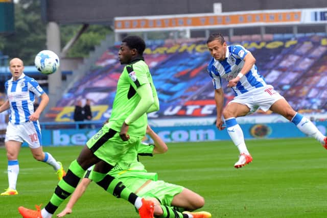 Chris Lowe strike goalwards for Huddersfield Town