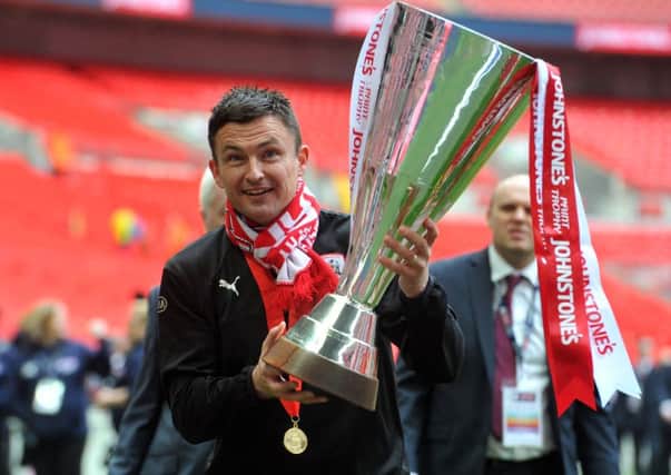 NICE ONE: Barnsley manager Paul Heckingbottom with the Football League Trophy after beating Oxford last season at Wembley. Picture by Tony Johnson