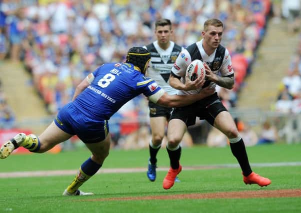 Hull's Marc Sneyd looks to get away from Warrington's Chris Hill.
 (picture: Jonathan Gawthorpe)