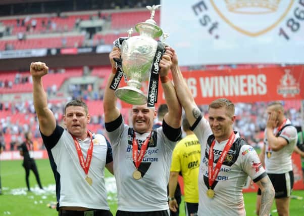Head coach Lee Radford, captain Gareth Ellis and man of the match Marc Sneyd celebrate a historic first Challenge Cup final victory for Hull FC at Wembley. (Picture: Jonathan Gawthorpe)