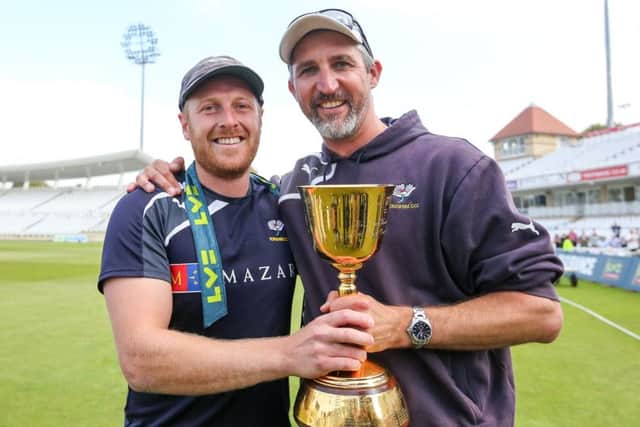 Yorkshire captain Andrew Gale and First Team Coach Jason Gillespie celebrate with the 2014 County Championship trophy. Picture by Alex Whitehead/SWpix.com