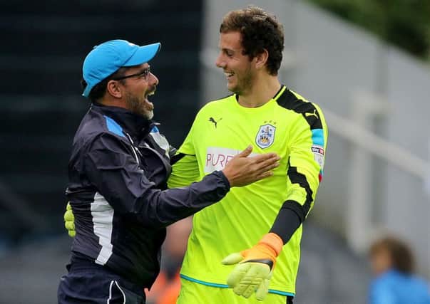 No 1: Huddersfield Town manager David Wagner celebrates with goalkeeper Danny Ward after the Championship win over Wolves at the John Smith's Stadium