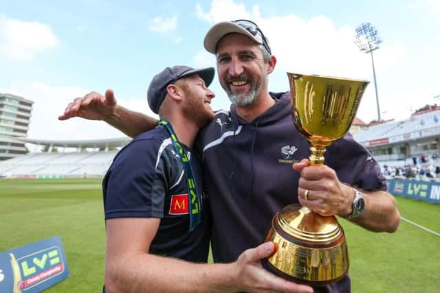 IT'S OURS: Yorkshire captain Andrew Gale and coach Jason Gillespie celebrate with the County Championship trophy at Trent Bridge back in 2014. Pictures: SWpix.