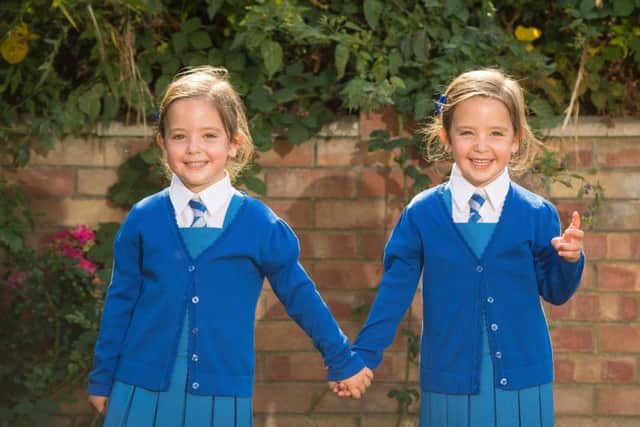 Twins Rosie (left) and Ruby Formosa who were born joined at the abdomen and shared part of the intestine, are due to start school in September. Picture: Dominic Lipinski/PA Wire