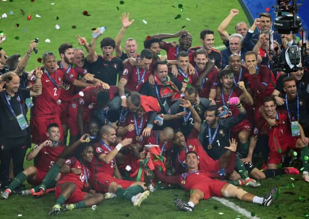 Portugal celebrate with the trophy after winning the UEFA Euro 2016. Photo: Joe Giddens/PA Wire.