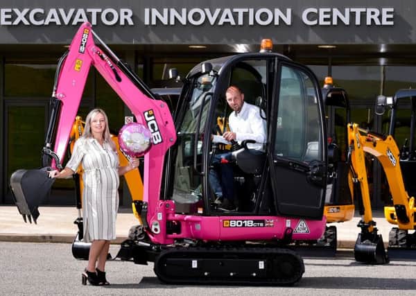 think pink: Scott Hardwick, owner of Hardwick Plant, and his partner Cheryl Woollands with the pink digger bought to celebrate the impending birth of their daughter Rosie.
