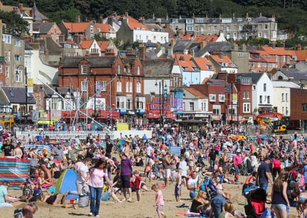 Sunbathers at South Bay beach in Scarborough on Bank Holiday Monday. Picture: Ceri Oakes