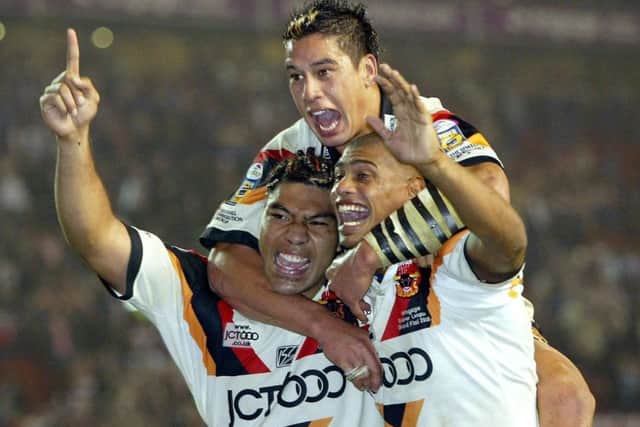 Bradford Bulls' Lesley Vainikolo, Shontyne Hape and Leon Pryce celebrate defeating Leeds Rhinos in the Super League Grand Final at Old Trafford in October 2005. Picture: Gareth Copley/PA.