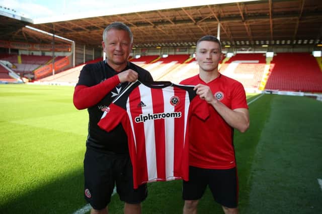Chris Wilder manager of Sheffield Utd welcomes new signing Caolan Lavery before the Checkatrade Trophy match at Bramall Lane Stadium, Sheffield. Picture date: August 30th, 2016. Pic Simon Bellis/Sportimage  -------------------- Sport Image 16/17 CONT Sheffield Utd v Leicester U23  30 August 2016 Â©2016 Sport Image all rights reserved