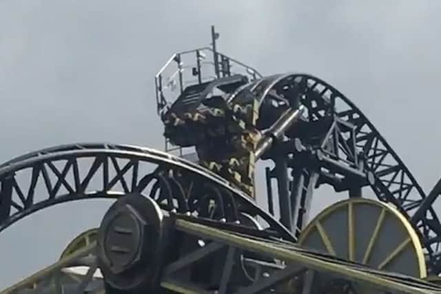 Screen grabbed image taken with permission from video issued by @Bifold_fitting of the Smiler rollercoaster at Alton Towers, Staffordshire, which has become stuck. Picture: @Bifold_fitting/PA Wire