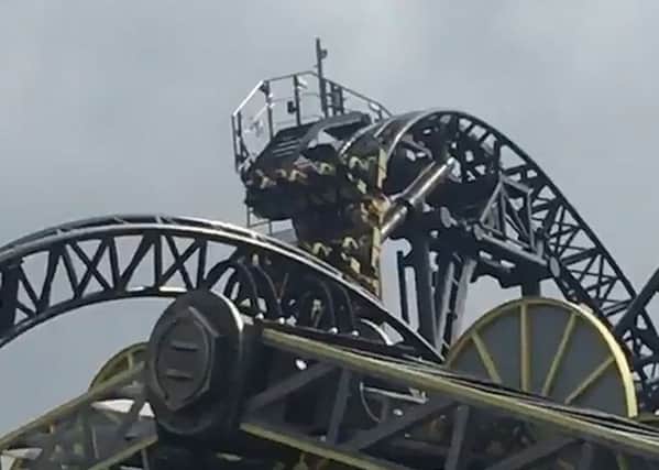 Screen grabbed image taken with permission from video issued by @Bifold_fitting of the Smiler rollercoaster at Alton Towers, Staffordshire, which has become stuck. Picture: @Bifold_fitting/PA Wire