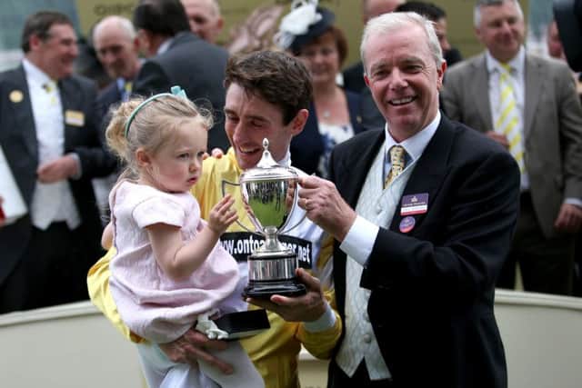 Jockey Dougie Costell and trainer Karl Burke (right) with the Commonwealth Cup after a winning ride on Quiet Reflection. Picture: David Davies/PA
