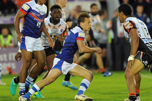 Wakefield's Jacob Miller attacks the Castleford defence.