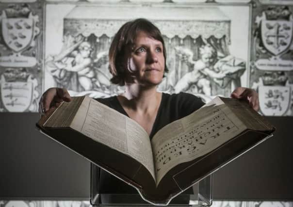 Leeds University's Rhiannon Lawrence-Francis with William Shakespeare's Comedies, Histories, and Tragedies, (the Fourth Folio), 1685, which is going on display as part of an exhibition to mark 400 years since the playwright's death at the university's new Treasures of the Brotherton Gallery.