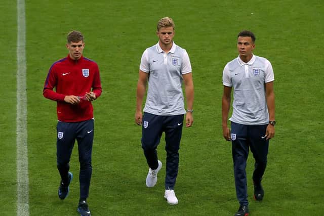 John Stones, Eric Dier and Dele Alli during a walkaround at the City Arena, Trnava.