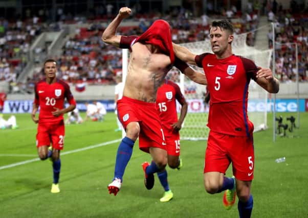 Adam Lallana leaps with joy after netting Englands stoppage-time winner in the World Cup Group F qualifier with Slovakia in Trnava (Picture: Nick Potts/PA Wire).