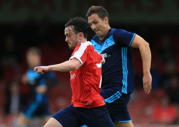 York City's Aidan Connolly seen in a pre-season friendly duelling with Middlesbrough's Stewart Downing (Picture: Nigel French/PA Wire).