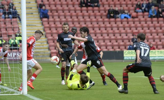 Doncaster's John Marquis can't get a shot in past the Crewe defence.  Picture: Bruce Rollinson