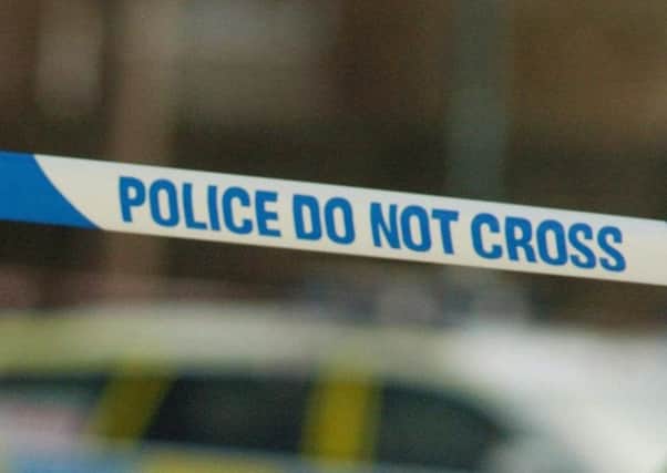 Two strangers robbed a woman in Hull.