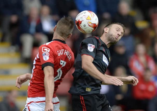 Jon Guthrie and Andy Williams challenge for a high ball as Crewe Alexandra met Doncaster Rovers on Saturday. (Picture: Bruce Rollinson)
