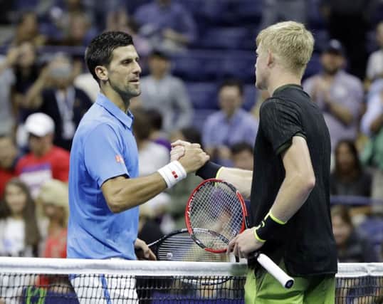 Serbia's Novak Djokovic is congratulated by Beverley's Kyle Edmund, right, after his win in New York (Picture: Darron Cummings/AP).