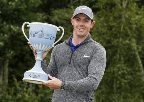 Rory McIlroy holds the trophy after winning the Deutsche Bank Championship (Picture: Michael Dwyer/AP).