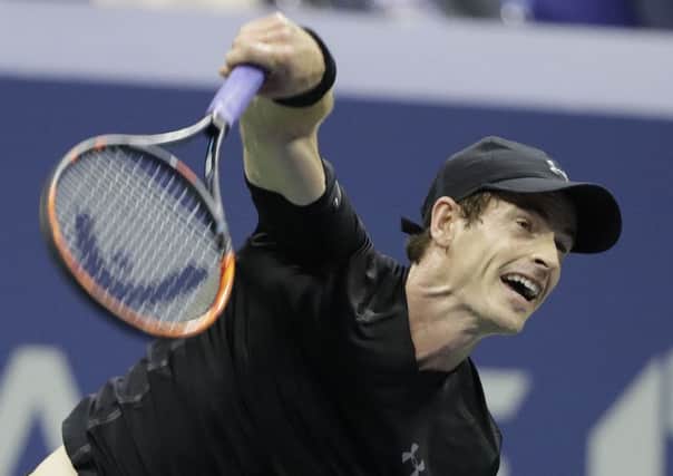 Andy Murray, of Britain, serves to Grigor Dimitrov, of Bulgaria, during the U.S. Open tennis tournament. (AP Photo/Darron Cummings)