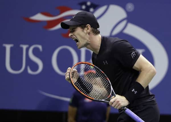 Britain's Andy Murray clenches his fist after winning a point against Grigor Dimitrov, of Bulgaria (Picture: Darron Cummings/AP).