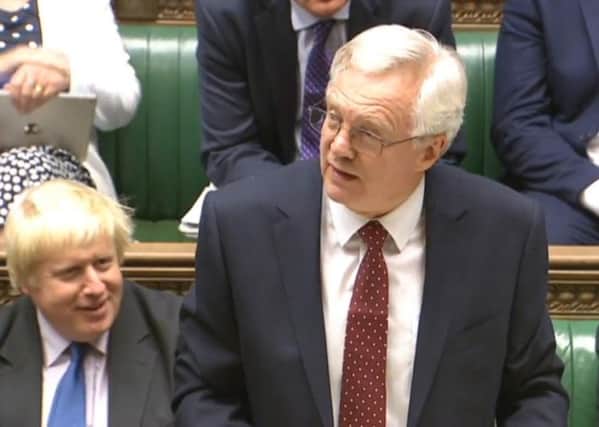 David Davis briefs MPs on Brexit as Boris Johnson watches on.