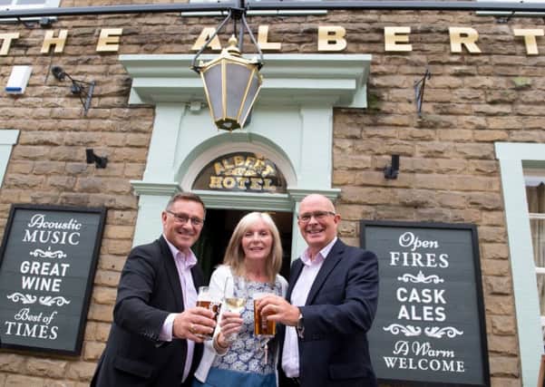 (L-R) Craig Whittaker MP, Victoria Percival licensee and Andy Hodgson, operations director at Admiral Taverns