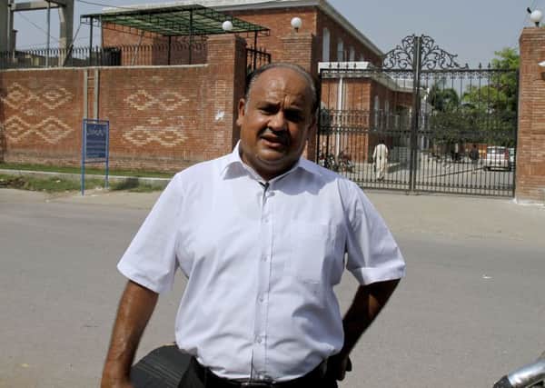Mohammad Arif, a defense lawyer in a British woman's murder case, outside the district court, in Jhelum, eastern Pakistan