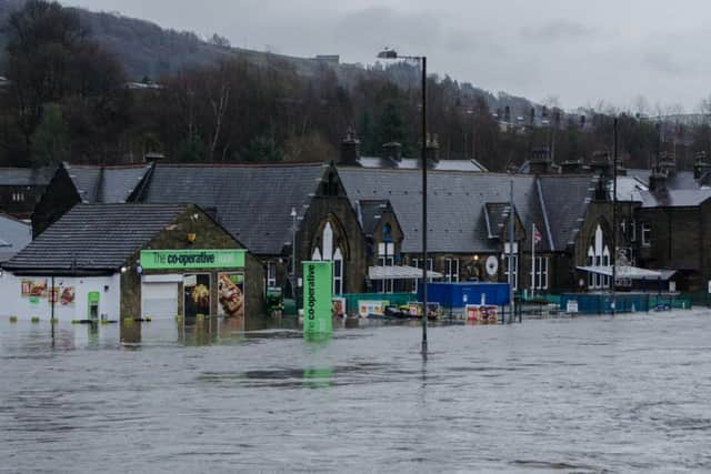 The flooded Co-op and Burnley Road, Mytholmroyd, last December