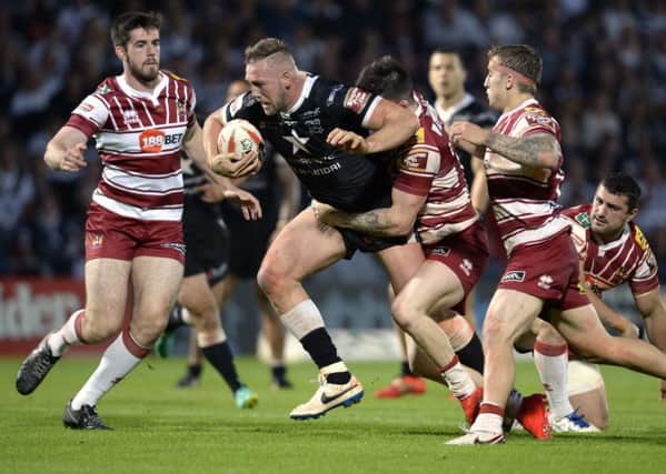 Liam Watts attacks Wigan Warriors' line as Hull FC head for victory in the Challenge Cup semi-final at the Keepmoat Stadium (Picture: Bruce Rollinson).