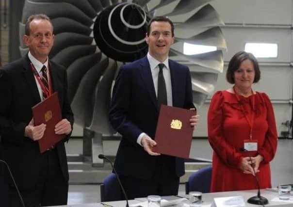 Combined Authority chairman Sir Steve Houghton, Chancellor George Osborne and Sheffield City Council leader Julie Dore at the signing of the draft deal last year