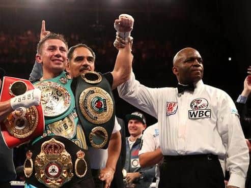 Gennady 'GGG' Golovkin shows off his middleweight titles after his stoppage win against Sheffield's Kell Brook